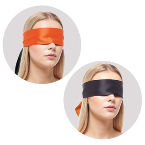Model wearing orange and black satin blindfolds.