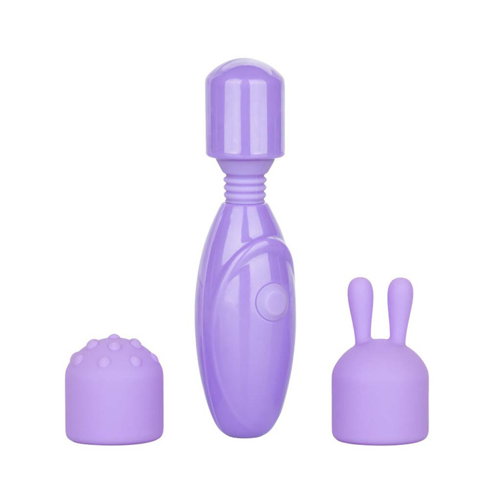 Purple massage wand with interchangeable heads on white