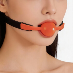 Closeup of person wearing orange ball gag
