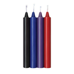 Four colorful taper candles on white background