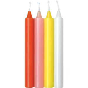 Four colorful taper candles on display