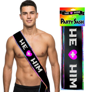 Shirtless man wearing black He Him party sash