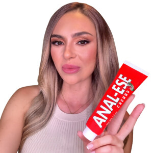 Person holding Anal-Ese Cherry tube product.
