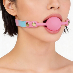 Pink ball gag with adjustable strap on model.
