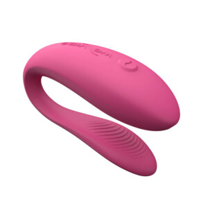 Pink curved personal massager on white background.