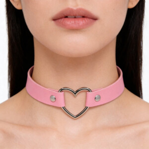 Pink heart choker necklace on woman's neck.