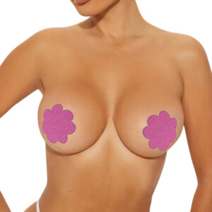 Woman wearing pink flower nipple covers.