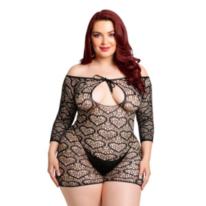 Woman in black lace dress standing