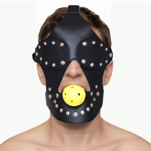 Masked individual with studded leather headgear.