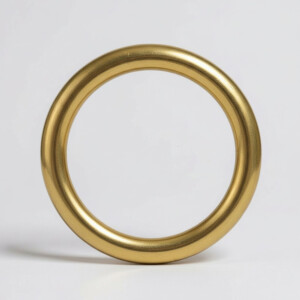 Gold metal ring on white background.