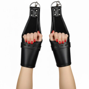 Black leather bondage restraints on two hands with red nails.