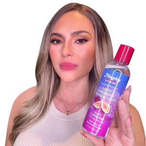 Woman holding Caribbean fruit lubricant bottle