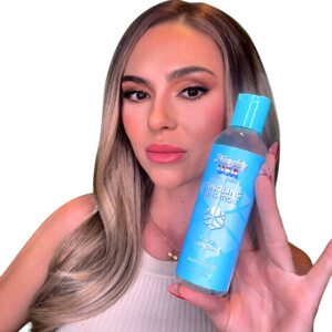 Person holding blue tingling lubricant bottle