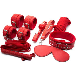 Red leather bondage accessories set on white background