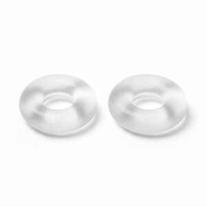 Two transparent rubber O-rings on white background.