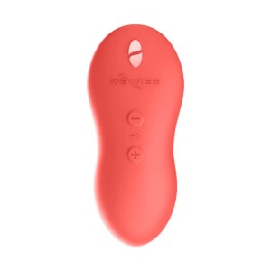 Red remote control with buttons, ergonomic design.