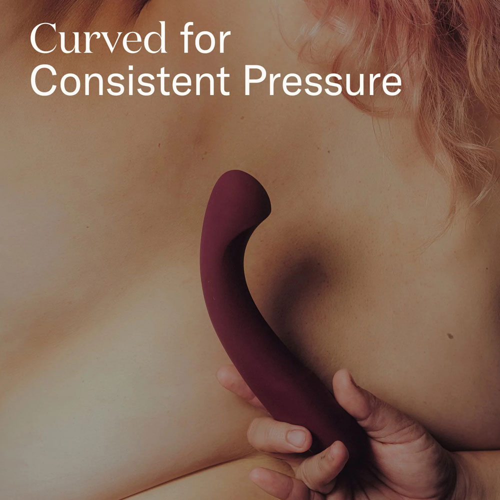 Curved massager for consistent pressure on skin.
