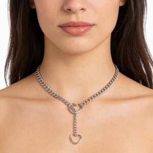 Woman wearing chain necklace with heart pendant