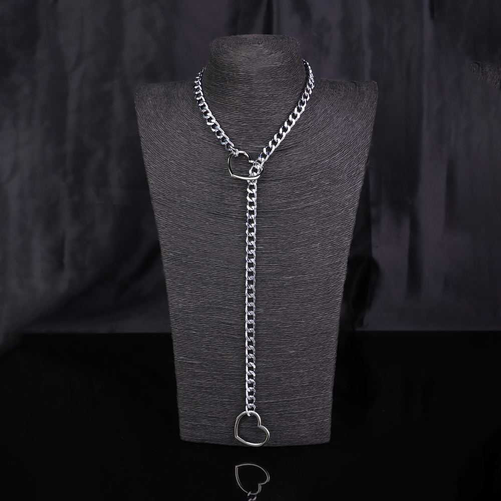 Silver heart chain necklace on display stand.