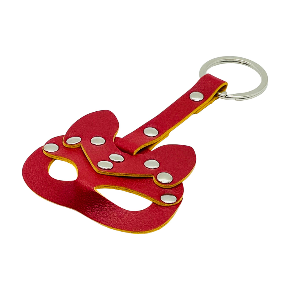 Red leather mask keychain with studs.