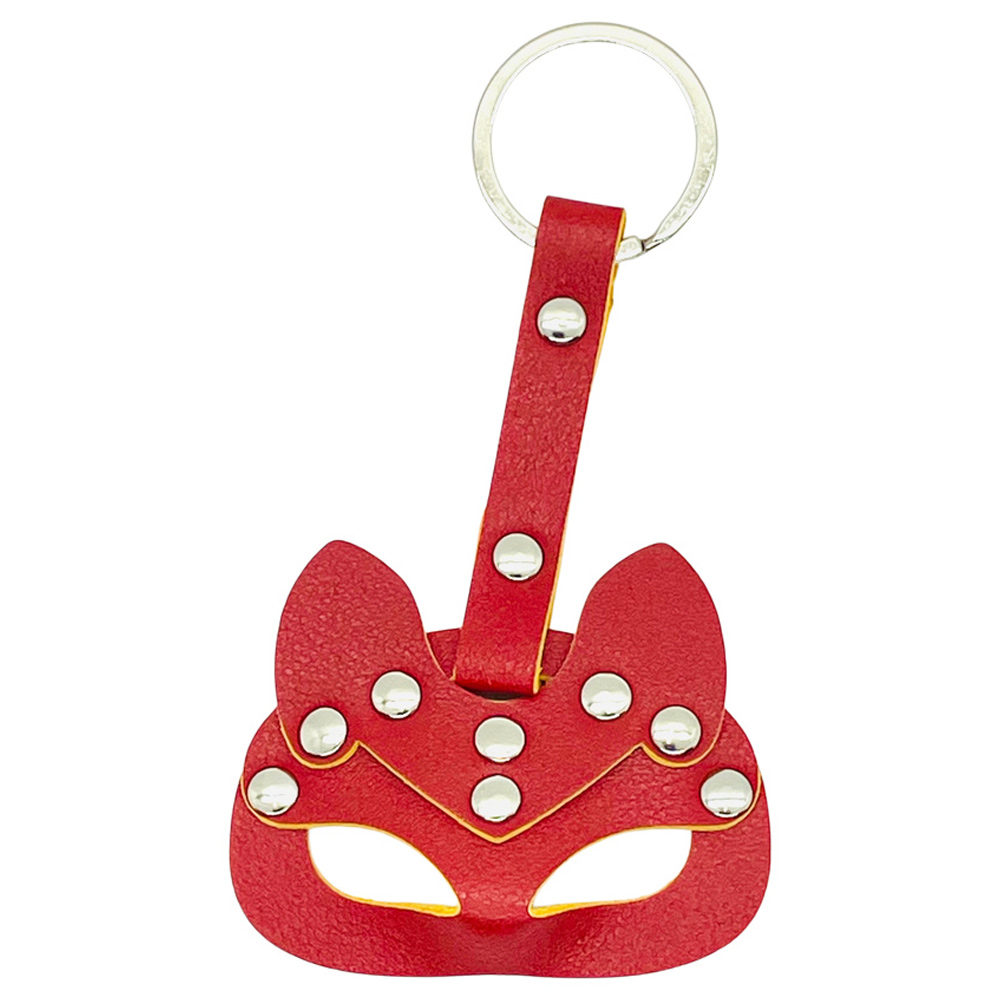 Red leather fox mask keychain with studs.