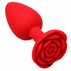 Red rose-shaped silicone anal plug on white background