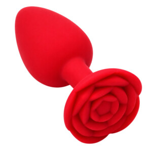 Red rose-shaped silicone plug on white background