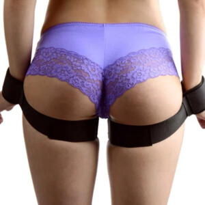 Person wearing purple lace underwear with black thigh straps