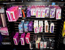 Romantic Depot Manhattan store interior displaying a variety of vibrators, dildos, and adult novelties arranged neatly on product racks.