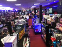 Romantic Depot Manhattan store interior showcasing shelves filled with adult toys, including vibrators and novelty items, organized for customer browsing.