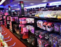 Romantic Depot Manhattan adult toy section displaying a variety of vibrators, dildos, and intimate products aimed at enhancing sexual experiences.