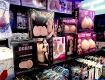 Romantic Depot Manhattan display of adult toys featuring cock rings, clit vibrators, and male masturbators for in-store browsing.
