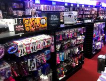 Romantic Depot Manhattan display of adult toys featuring cock rings, clit vibrators, and male masturbators for in-store browsing.