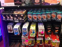 Romantic Depot Manhattan sex toy store showcasing a wide range of anal toys, vibrators, and realistic dildos arranged on retail shelves.