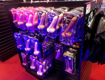 Romantic Depot Manhattan showcasing anal toys, cock rings, and vibrating dildos arranged neatly on retail display shelves.