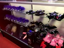 Interior view of Romantic Depot Manhattan showcasing shelves of dildos, vibrators, and adult toys