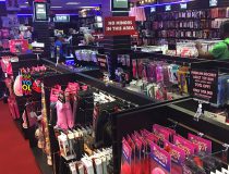 Adult toy shelves at Romantic Depot Manhattan showcasing dildos, vibrators, and pleasure products for couples