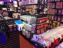 Romantic Depot Manhattan display showcasing various adult toys and accessories arranged neatly on shelves, highlighting product variety and in-store layout.