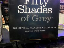 Display of BDSM gear at Romantic Depot Manhattan featuring bondage kits, ball gags, floggers, and blindfolds for kink and fetish play.