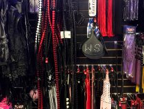 Wall of bondage accessories at Romantic Depot Manhattan including paddles, ropes, cuffs, and BDSM restraints for beginners and enthusiasts.