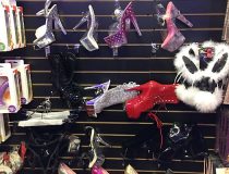 Front display at Romantic Depot Manhattan showcasing sexy high heels and fetish footwear for women near the store entrance.