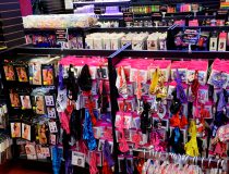 Lingerie wall at Romantic Depot Manhattan featuring sexy teddies, lace bras, and intimate apparel