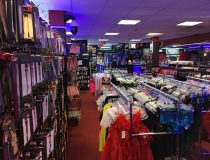 Lingerie wall display at Romantic Depot Manhattan showcasing lace lingerie, sexy teddies, and intimate outfits