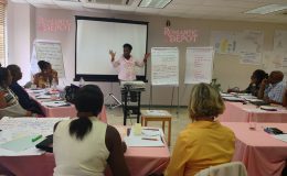 Romantic Depot workshop with diverse adults attending a sex education seminar in a classroom setting