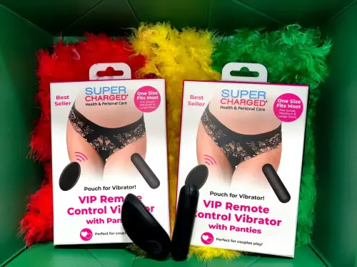 Super Charged VIP Remote Control Vibrator with Panties – best seller couples toy displayed with red, yellow, and green feather boas