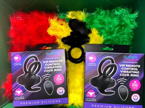 VIP Remote Control Vibrating Cock Ring – premium silicone couples toy displayed with red, yellow, and green feather boas